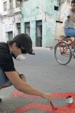 painting activist on the streets in Recife