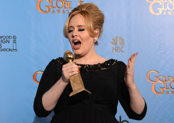 Adele with the Golden Globe for best original song