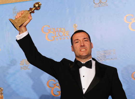Brave director Mark Andrews with his Golden Globe for best animated feature