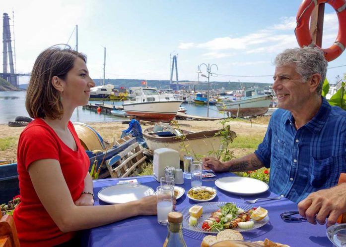 Bourdain eating with Esra, who's present in both episodes in Istanbul