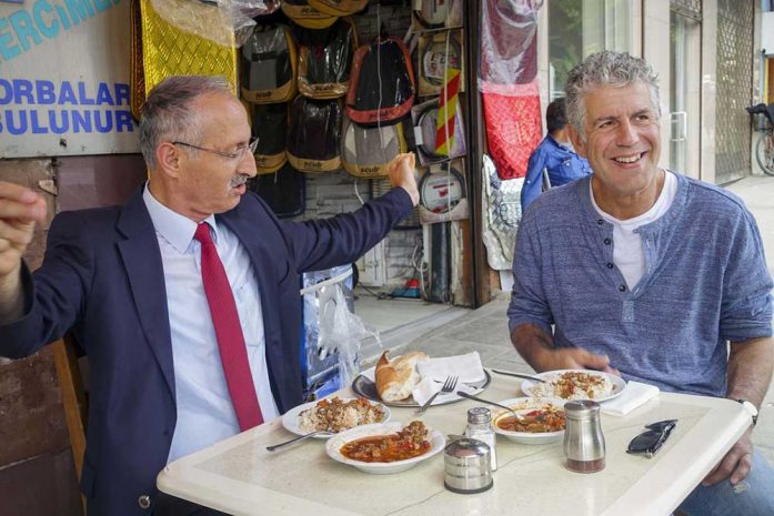 Anthony Bourdain having a meal with the crazy driver